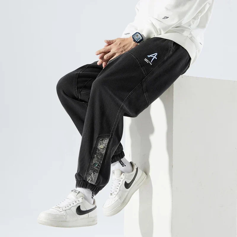 Men's Tapered Denim Joggers Featuring Panelled Seams And Elastic Waist