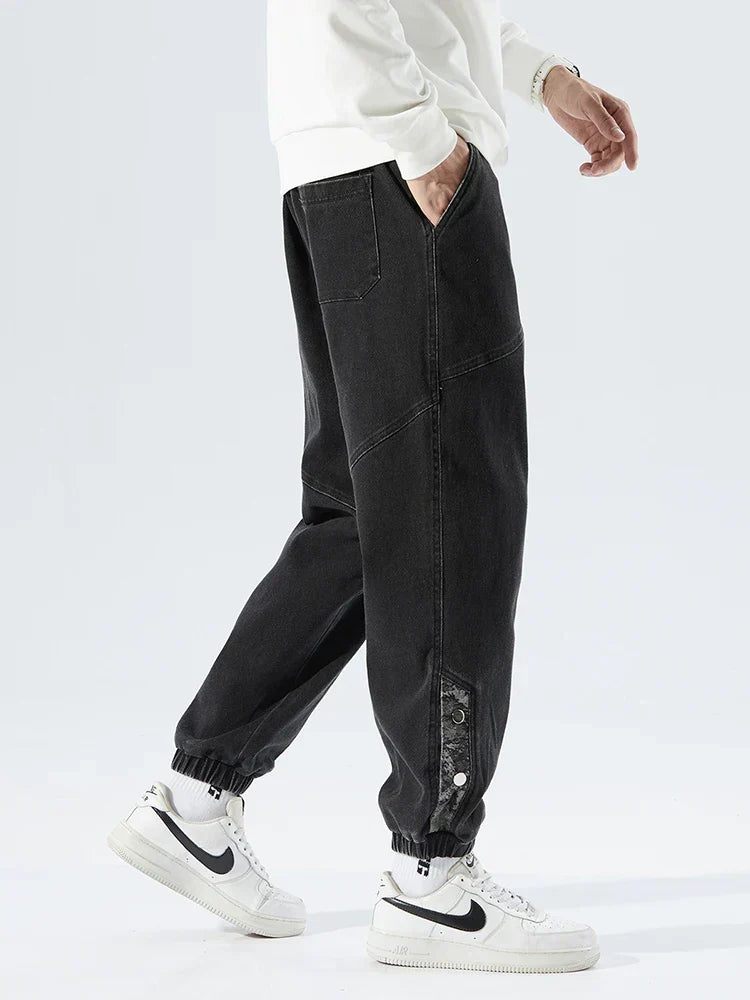 Men's Tapered Denim Joggers Featuring Panelled Seams And Elastic Waist