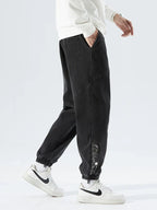 Men's Tapered Denim Joggers Featuring Panelled Seams And Elastic Waist