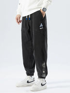 Men's Tapered Denim Joggers Featuring Panelled Seams And Elastic Waist