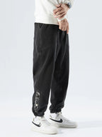 Men's Tapered Denim Joggers Featuring Panelled Seams And Elastic Waist