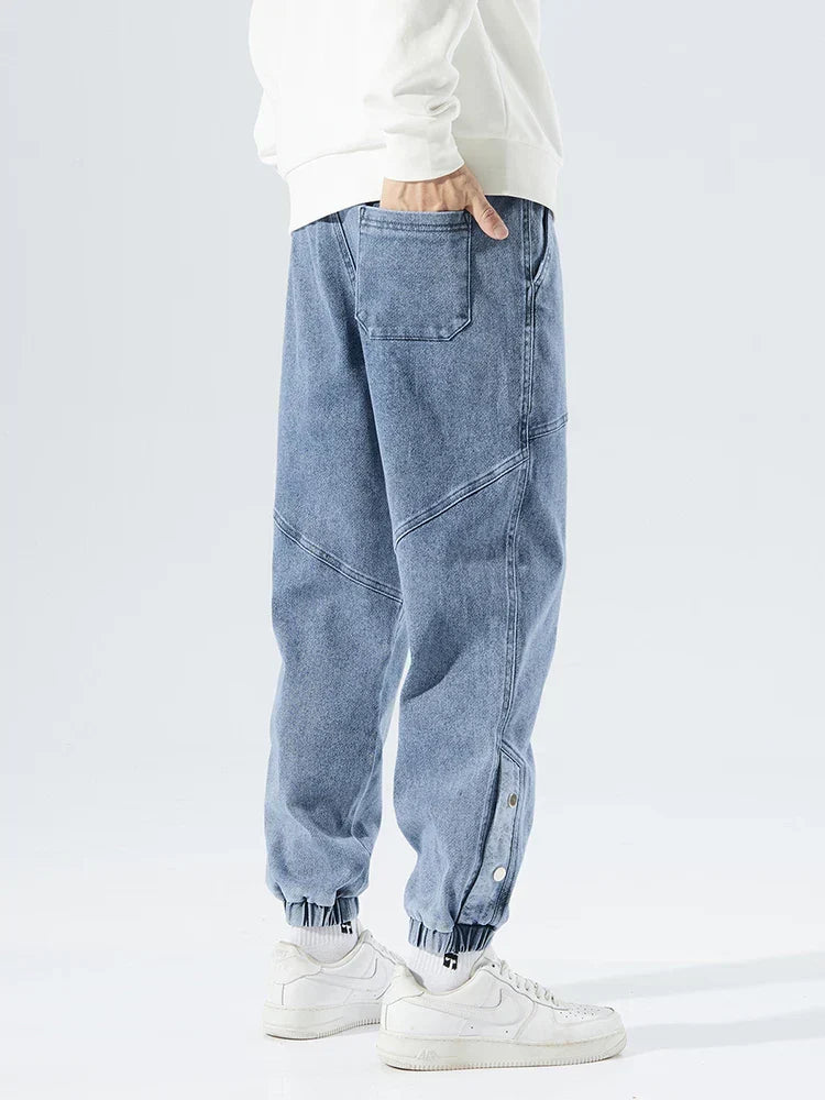 Men's Tapered Denim Joggers Featuring Panelled Seams And Elastic Waist
