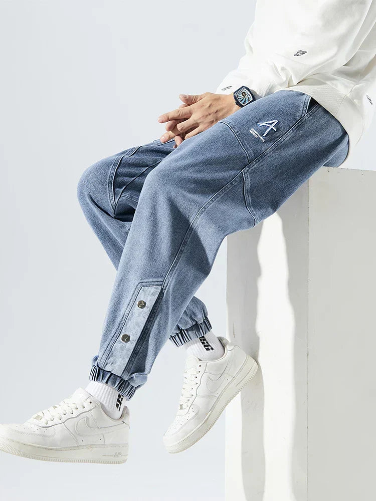 Men's Tapered Denim Joggers Featuring Panelled Seams And Elastic Waist