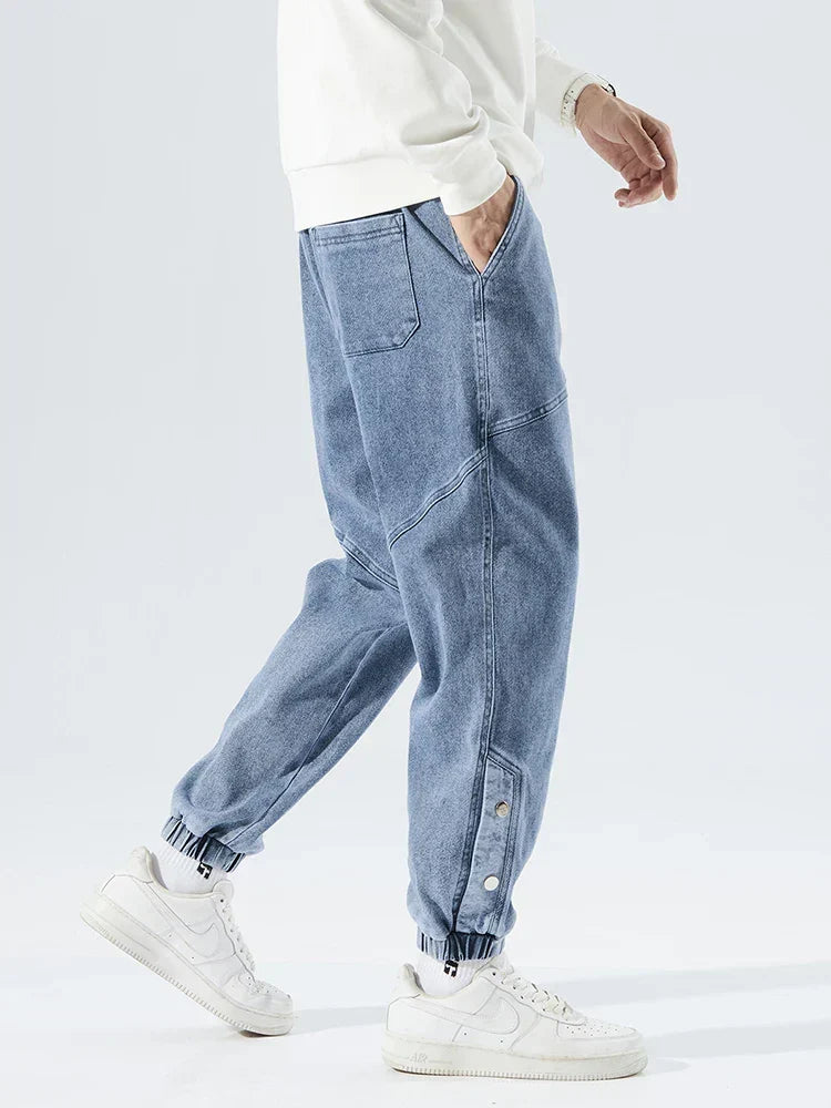 Men's Tapered Denim Joggers Featuring Panelled Seams And Elastic Waist
