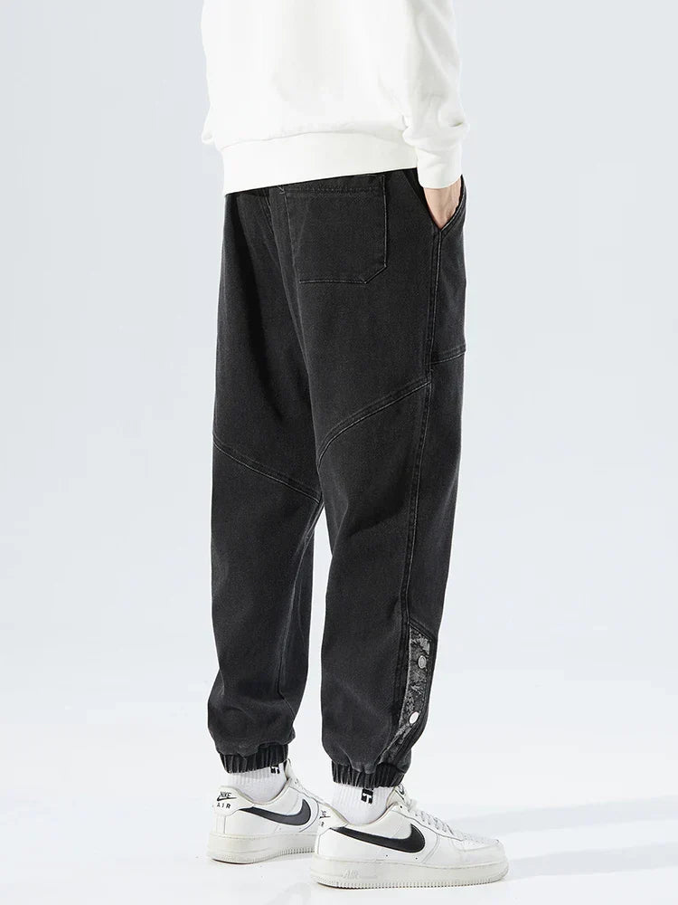 Men's Tapered Denim Joggers Featuring Panelled Seams And Elastic Waist