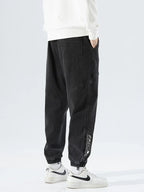 Men's Tapered Denim Joggers Featuring Panelled Seams And Elastic Waist